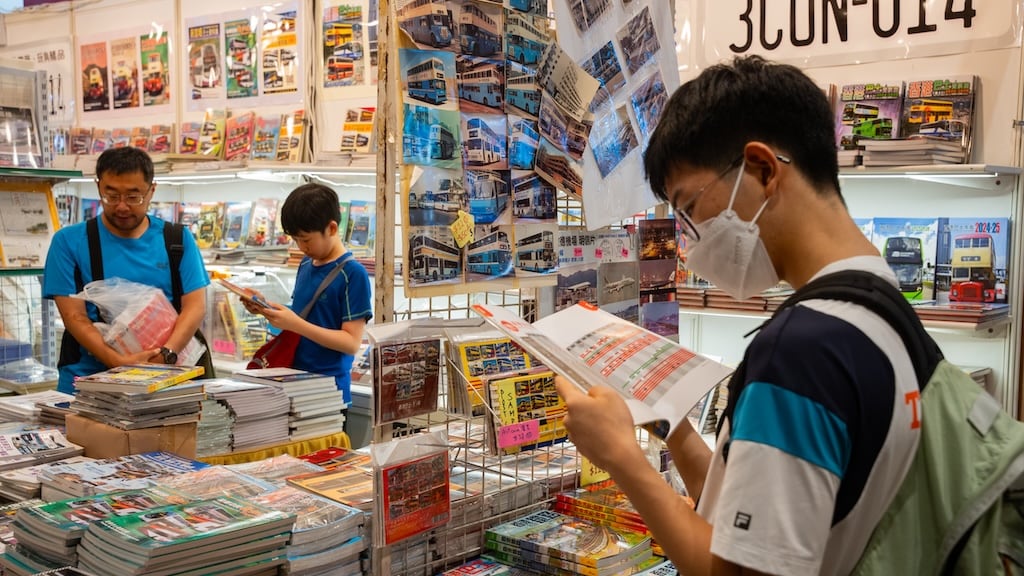 Visitors exploring the stationery and multimedia section of the book fair