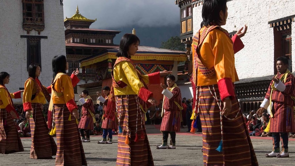 Bhutanese people in traditional dress attending the festival